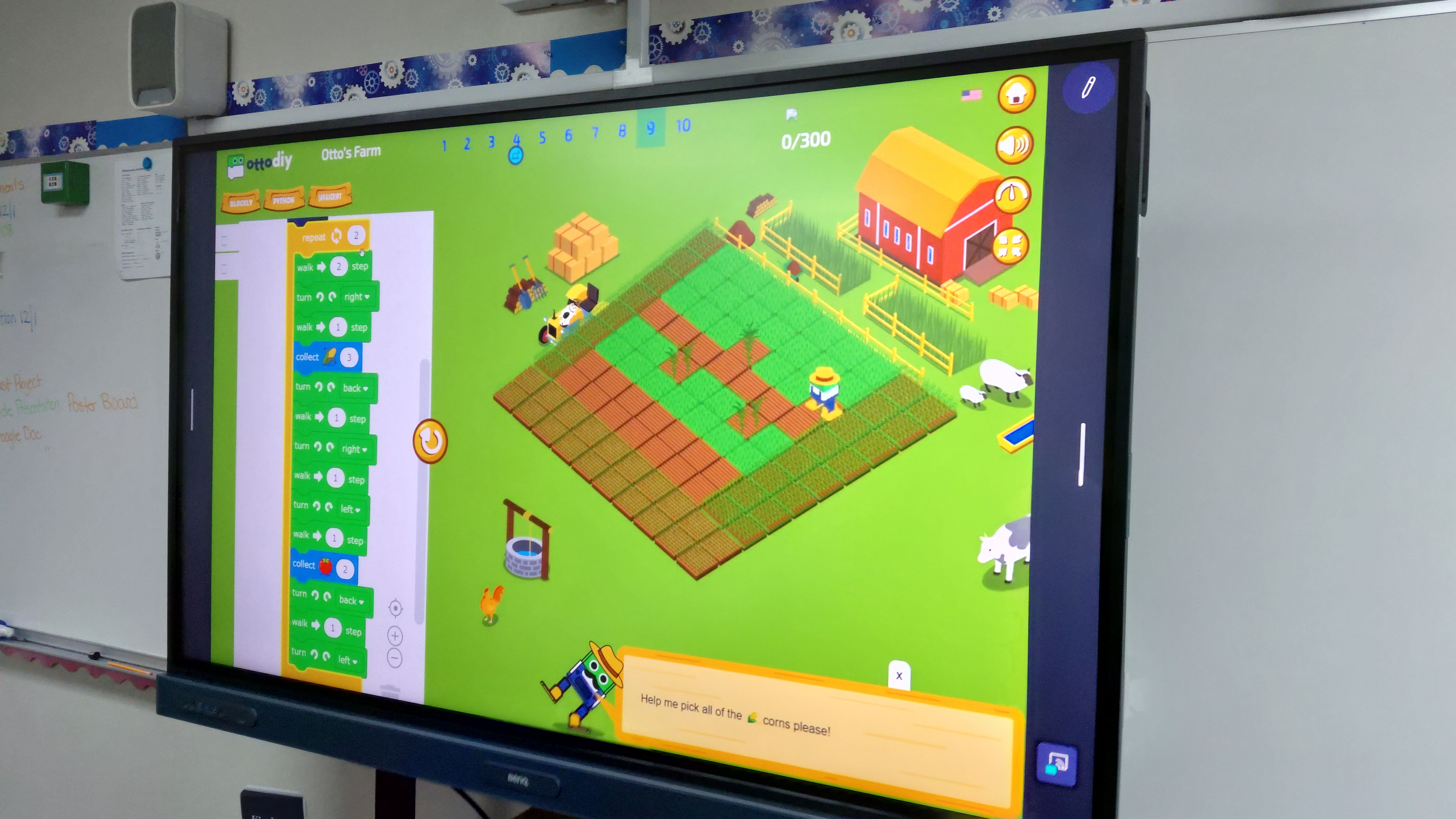 Students at laptops: Tinkercad 3D design and block-based robotics coding with a small robot on the desk